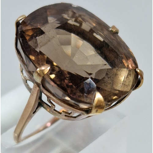 265 - Yellow metal and smokey quartz dress ring. 11.3g approx. Size O1/2.  (B.P. 21% + VAT)