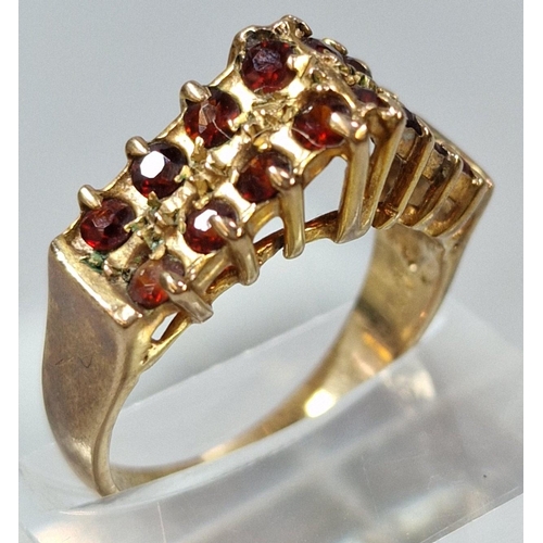 267 - 9ct gold and garnet cluster ring. 4.3g approx. Size O.  (B.P. 21% + VAT)