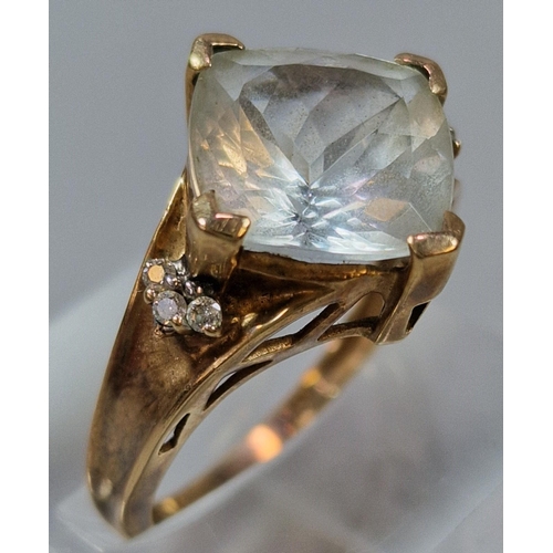 269 - 9ct gold clear stone dress ring inset with six tiny diamond chips. 4.3g approx. Size O.  (B.P. 21% +... 