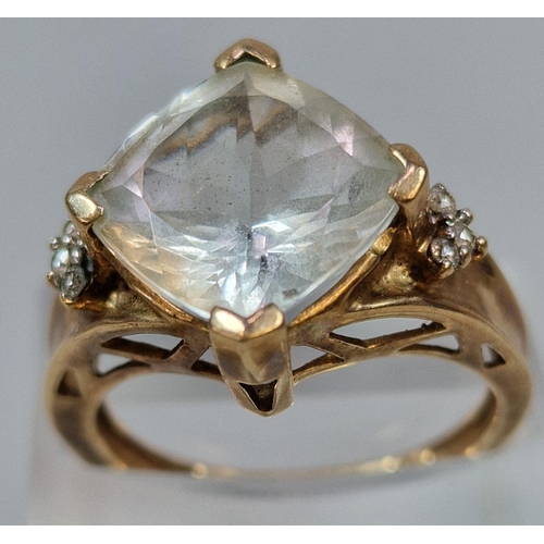 269 - 9ct gold clear stone dress ring inset with six tiny diamond chips. 4.3g approx. Size O.  (B.P. 21% +... 