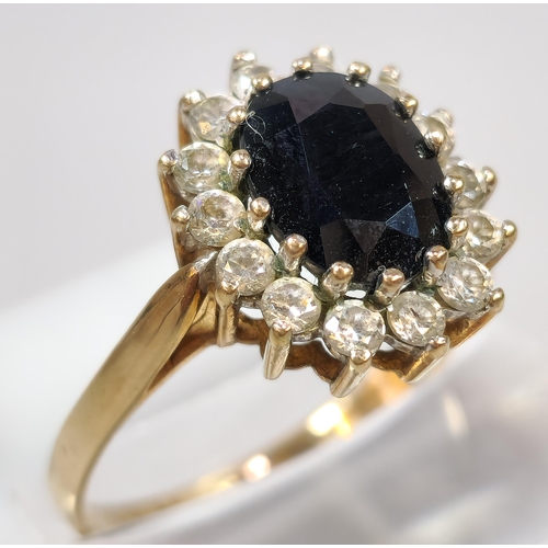 273 - 9ct gold blue and clear stone cluster ring. 3g approx. Size Q. (B.P. 21% + VAT)