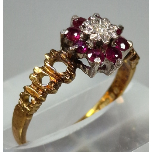 274 - 18ct gold diamond and ruby flower head ring. 3g approx. Size N. (B.P. 21% + VAT)