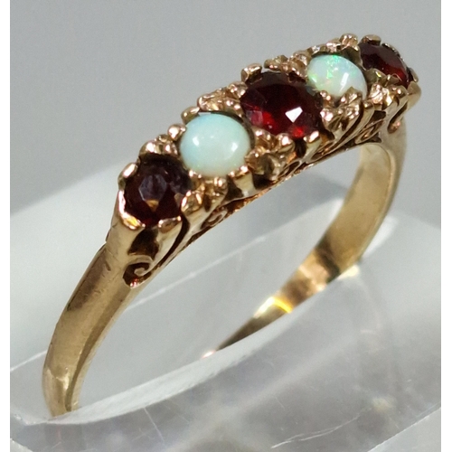 275 - 9ct gold opal and ruby stone five stone dress ring. 1.8g approx. Size L1/2. (B.P. 21% + VAT)