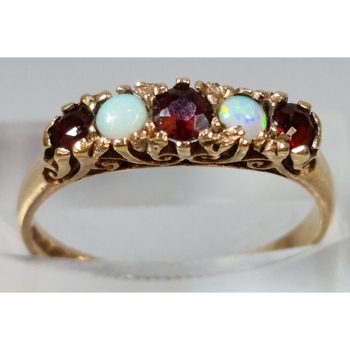 275 - 9ct gold opal and ruby stone five stone dress ring. 1.8g approx. Size L1/2. (B.P. 21% + VAT)