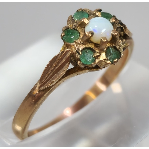 277 - 9ct gold opal and green stone flowerhead ring (missing one stone). 1.7g approx. Size M. (B.P. 21% + ... 