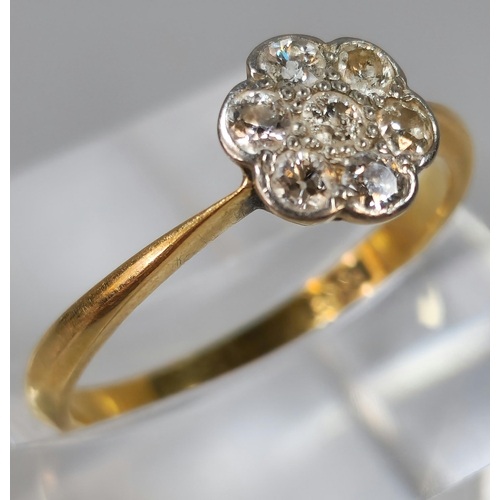 284 - 18ct gold diamond flowerhead ring. 2.4g approx. Size P. (B.P. 21% + VAT)