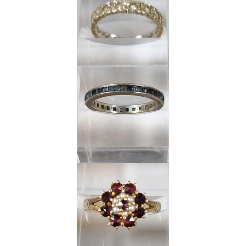 286 - 9ct gold eternity style ring together with a silver blue stone eternity style ring and 9ct gold garn... 