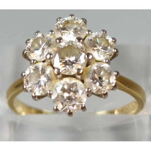 287 - 18ct gold seven stone diamond cluster ring. 4.1g approx. Size O1/2. (B.P. 21% + VAT)