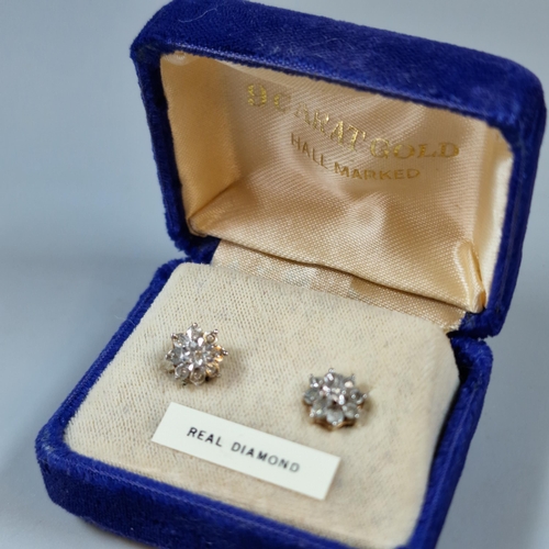 293 - Pair of 9ct gold and diamond flowerhead cluster earrings. 1.7g approx. In fitted box. (B.P. 21% + VA... 