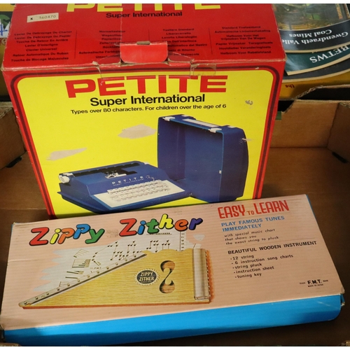 380 - Petite Super International typewriter in original box, together with an easy to learn Japanese Zippy... 