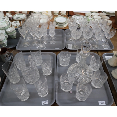 393 - Four trays of assorted glassware to include: hock glasses, wine glasses, whisky tumblers, star shape... 