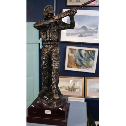 442 - Composition bronzed figurine of a clay pigeon shooter on square stepped base. 70cm high approx.  (B.... 