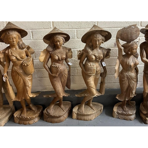 456 - Large collection of  Balinese carved wood nude and semi-nude women, mainly at work with baskets and ... 