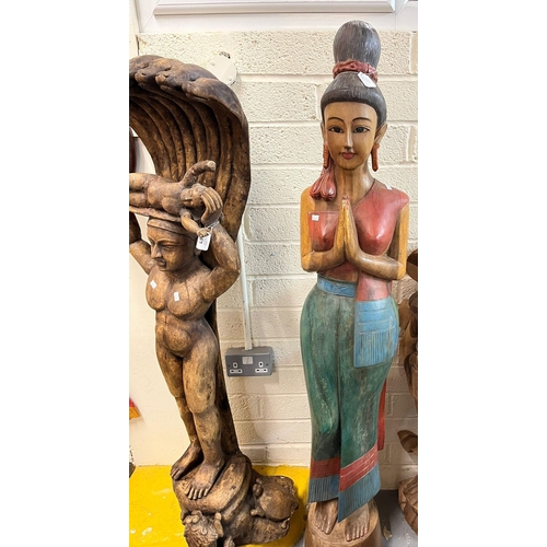 457 - Wood carving of a Thai Sawasdee lady standing 160cm approx. high together with a Burmese wood carvin... 