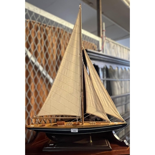 466 - Wooden model of a sailing boat/pond yacht with cloth sails. 87cm high approx. (B.P. 21% + VAT)