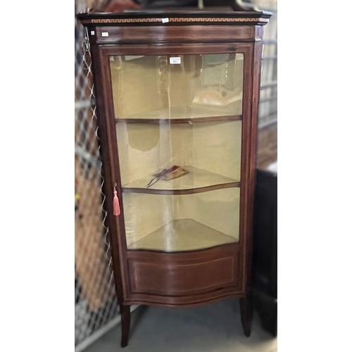 467 - Edwardian mahogany inlaid serpentine corner display cabinet with fixed shelves. (B.P. 21% + VAT)