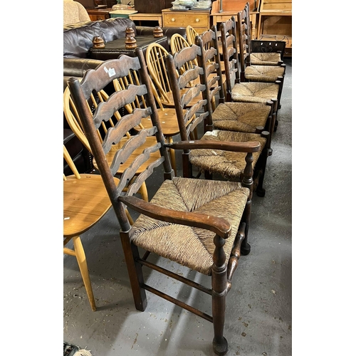 506 - Set of six Lancashire style ladder back kitchen chairs on rush seats. (5+1) (6).  (B.P. 21% + VAT)