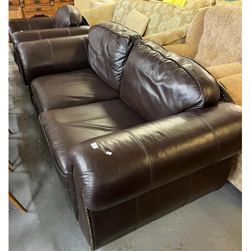 510 - Thomas Lloyd, a modern leather three piece suite comprising large two seater sofa, armchair and stoo... 