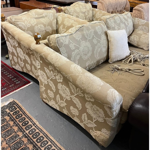 512 - Modern beige and cream ground upholstered 'Knole' type floral and foliate three piece suite comprisi... 