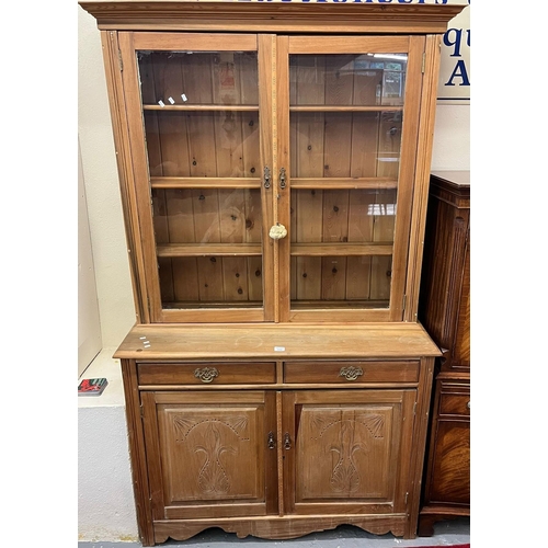 516 - Early 19th century stripped chiffonier bookcase with moulded cornice over two glazed doors with thre... 