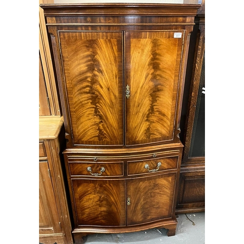 517 - Reproduction mahogany bow front blind panelled cocktail cabinet. (B.P. 21% + VAT)