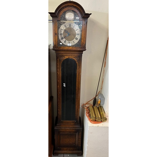 518 - 20th century oak Grandmother clock having arched face with silvered Roman chapter ring above glazed ... 