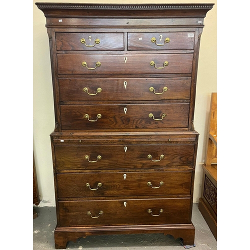 527 - George III oak two stage chest on chest, the dental and moulded cornice above an arrangement of two ... 