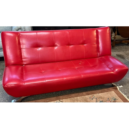 541 - Mid century red leather look Italian designer sofa bed on chrome supports.  (B.P. 21% + VAT)