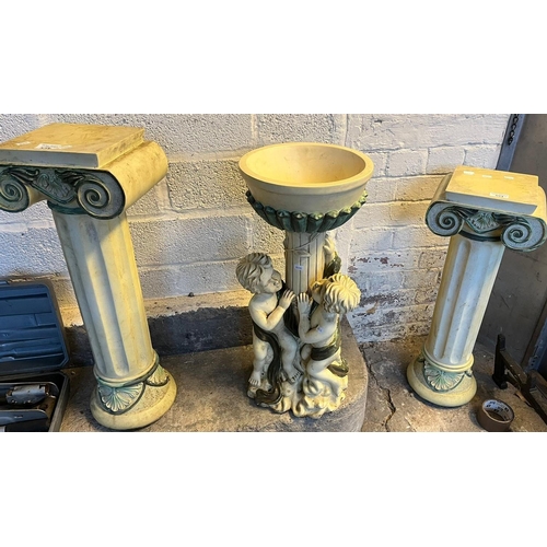 554 - Pair of Doric design pedestals, 69cm high approx. together with a modern bird bath with cherubs. (3)... 