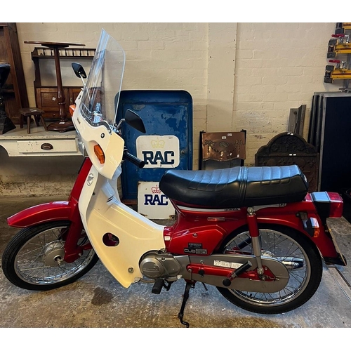 555 - MOTORCYCLE to be sold at 12 Noon precisely.
1997 Honda C90 Cub 'Step through' motorcycle, Reg No R28... 