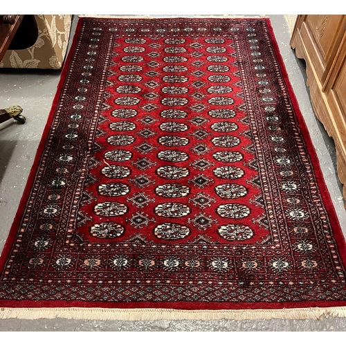 582 - Red ground Bokhara design rug. 179cm x 124cm approx. (B.P. 21% + VAT)