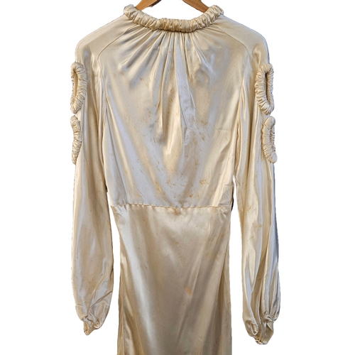 586 - circa 1960s long trained wedding gown of ivory sateen. Cuffs and front panel with self-coloured gilt... 