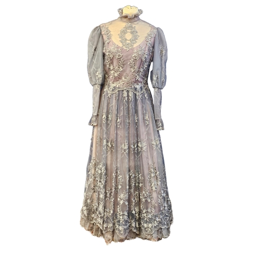 587 - 1970s/80s evening dress in lilac/grey in colour, by 'Ellis', Edwardian style with machine embroidere... 