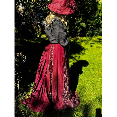 588 - Victorian maroon bustle cotton skirt with floral patterned panels to the centre, front and sides, ga... 