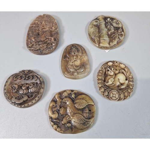 59 - Group of five Japanese hardstone pendants in traditional designs. (5)  (B.P. 21% + VAT)