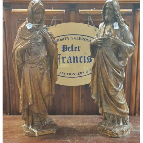 95 - Two composition/plaster figurines of Jesus and Mary, both signed indistinctly to the bases. 87cm hig... 