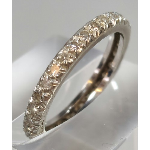 282 - White metal and diamond full eternity ring. Unmarked. 2.6g approx. Size M. (B.P. 21% + VAT)