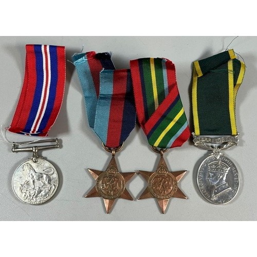 106 - WWII medal group of four comprising: 39-45 Star, Pacific Star, 39-45 War Medal and Territorial Effic... 