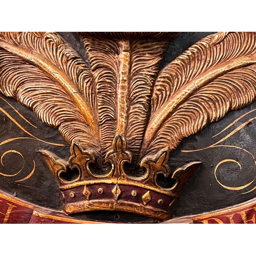 115A - Carved wood and polychrome composition oval Prince of Wales Feathers panel in the form of an 18th ce... 