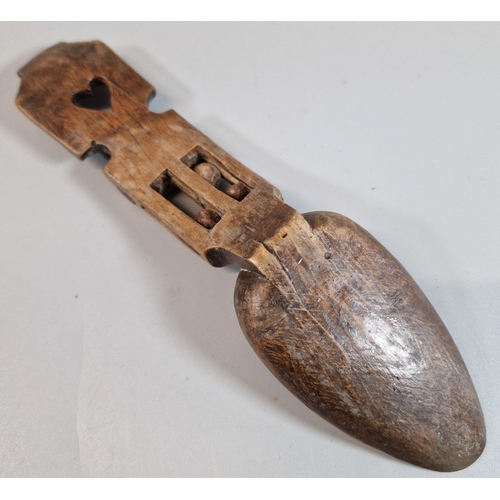 140 - 19th century Welsh Love spoon with carved heart decoration with three ball in a cage above the bowl.... 