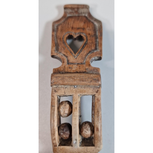 140 - 19th century Welsh Love spoon with carved heart decoration with three ball in a cage above the bowl.... 