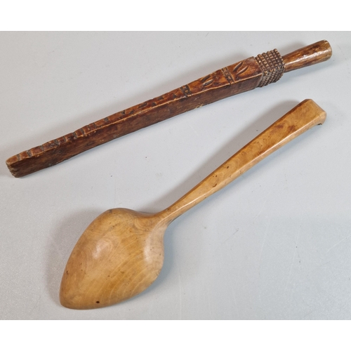 143 - Treen - well carved wooden serving spoon together with a needle worker's wedge/stay with chip carved... 