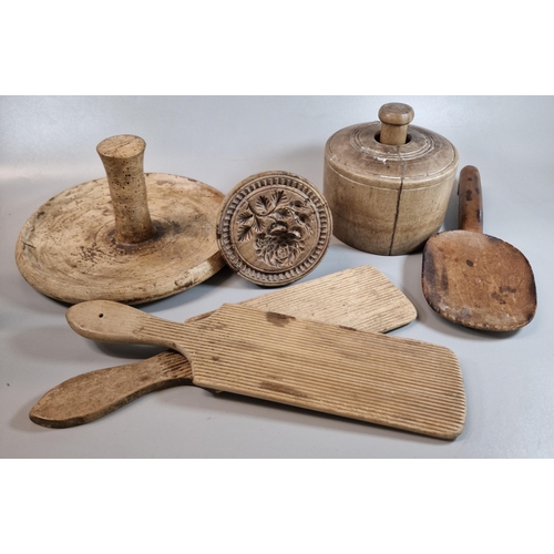 144 - Treen - a collection of 19th century kitchenalia items to include: butter pats, ladle, butter worker... 