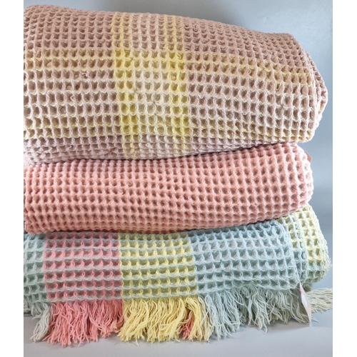 166 - Three vintage honeycomb blankets, varying colours including: duck egg, yellow, pink etc. (3) (B.P. 2... 