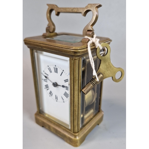 179 - Antique French brass repeating carriage clock with Roman numerals. With key. (B.P. 21% + VAT)