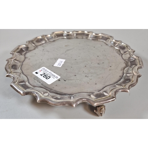 260 - George V silver pie crust salver standing on three scroll feet. Maker's mark's HW, Sheffield 1930. 2... 