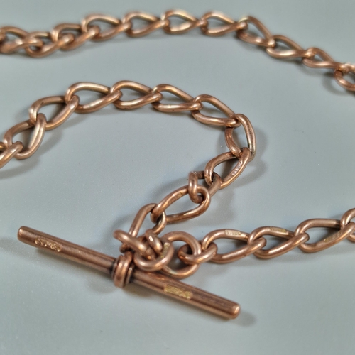 279 - 9ct rose gold curb link T bar Albert pocket watch chain. 28.5g approx. (B.P. 21% + VAT)