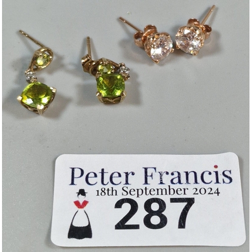 287 - Pair of 14ct gold clear stone earrings. 2.2g approx. together with a pair of 9ct gold green stone ea... 