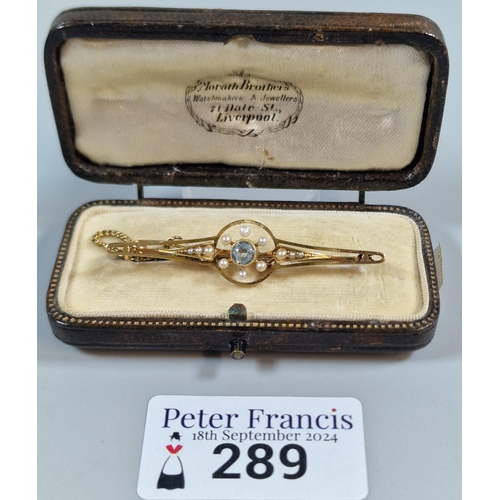 289 - Early 20th century 15ct gold blue stone and seed pearl bar brooch in fitted leather box. 3.8g approx... 