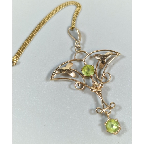 291 - 9ct gold fine link chain with Art Nouveau design pendant inset with green stones. Total length 27cm ... 